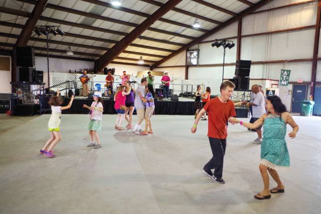 Crawfish fest goes 'down home' People dancing to the music of The Revelers.