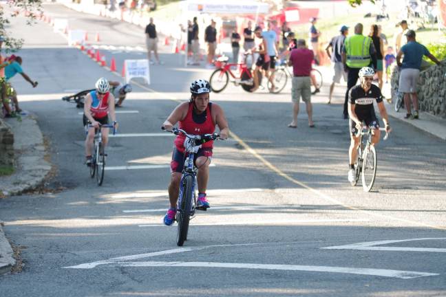 Another big triathlon for Pass it Along Triathlete Laura White of Newton, N.J. pedals during the cycling part of the triathlon. White finished in 138th place overall with a time of 1:40:57.