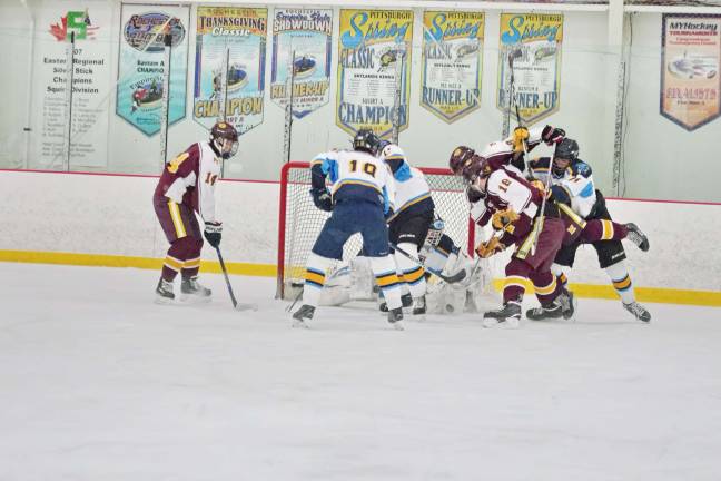 Madison bests Sparta-Jefferson on the ice Sparta-Jefferson United goalie Logan Hanek drops down and blocks the puck during a Madison shot in the first period. Hanek blocked 28 shots.