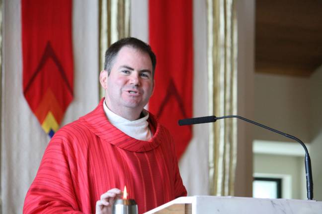 Knights-sponsored seminarian is ordained Father Tom Gibbons delivering his first homily at Blessed Kateri Parish in Sparta