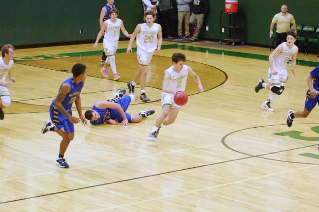 Sussex Tech's Alec Aguiar handles the ball in the second quarter. Aguiar scored 10 points.