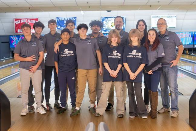 Members of the Sparta High School bowling team pose with coaches Jerry Carter, Samantha Carter and Troy Fetherman.