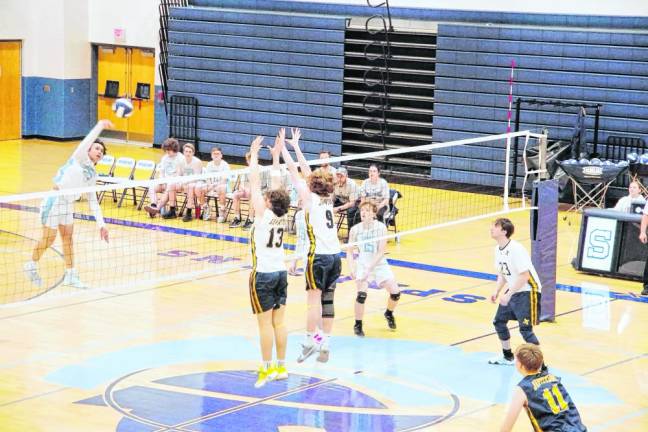 At left Sparta's Joshua Tolentino strikes the ball toward the Jefferson side of the net. He was credited with 11 kills and four aces.