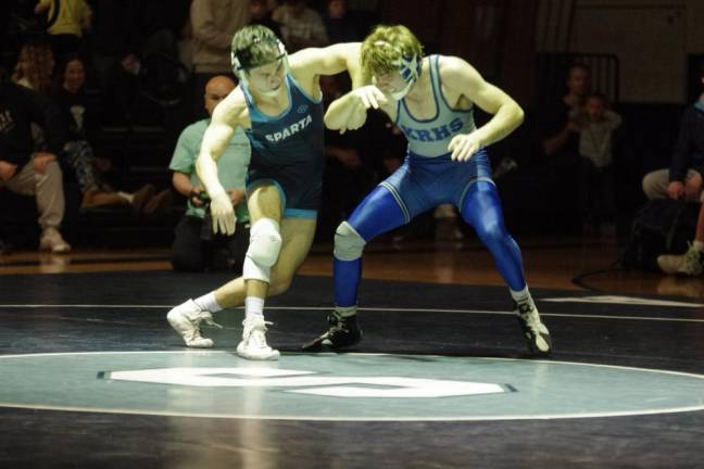 Sparta’s Eugene Donnelly grapples with Kittatinny’s Jacob Savage in the 144-pound weight class. Savage won by decision, 7-0. (Photos by George Leroy Hunter)