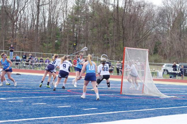 Mead leads Sparta girls to lacrosse victory over Pope John Sparta's Julianna McGuire launches the ball towards the goal post. McGuire scored one goal.
