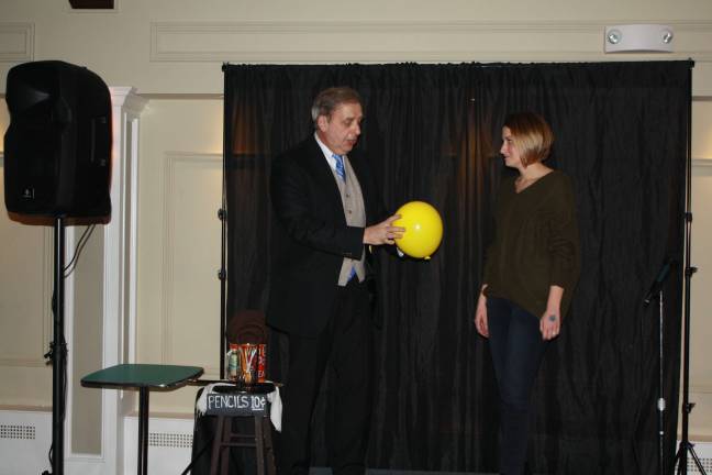 Laughter on the lakeside Sparta Avenue Stage owner Joe Garsetti does a magic trick for audience member Nicole Garcia.