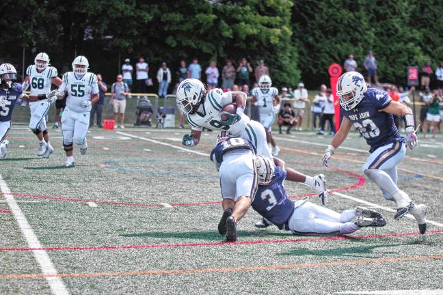 Football roundup: High Point beats Jefferson <b>Pope John defenders tackle a DePaul ball carrier. (Photo by George Leroy Hunter)</b>