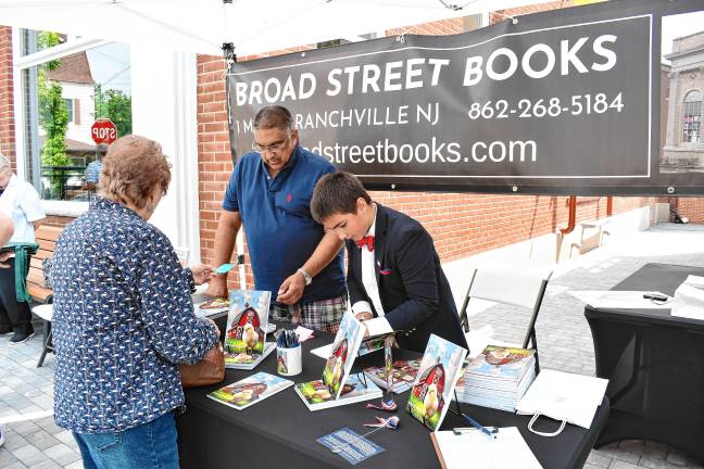Young author’s book deals with big themes ZS1 Zy Saturnees, 11, signs his book, ‘Jill the Chick,’ on Saturday, July 26 outside Broad Street Books in Branchville. (Photos by Maria Kovic)