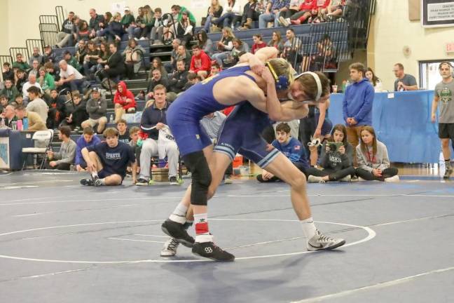 Cooper Stewart pulls his opponent down to the mat on the way to his 1st of 3 wins.