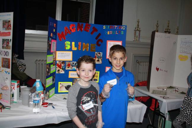 Scientists of tomorrow shine forth Mark Clifford and Trevor Ekland in front of their Magnetic Slime creation. Photos by Rose Sgarlato