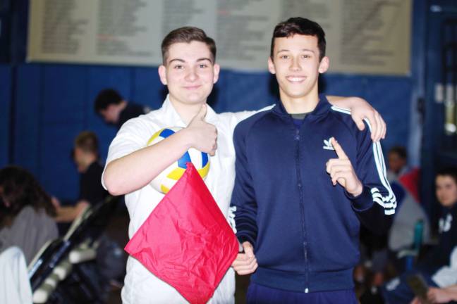 Pope John's strikes down Dover in volleyball Pope John volleyball line judges Joe Caravella and Luke Dykstra Photos by George Leroy Hunter