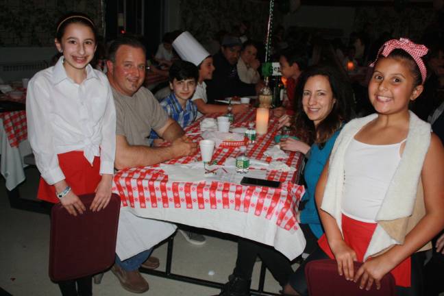 Kids serve parents at Annual Spaghetti Dinner Gianna Cortese, left, with her family and co-server Paige Shabeen.