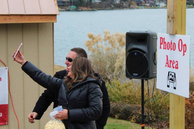 Lake Mohawk German Christmas Market 2018 A couple takes advantage of the "photo op" along the lake.