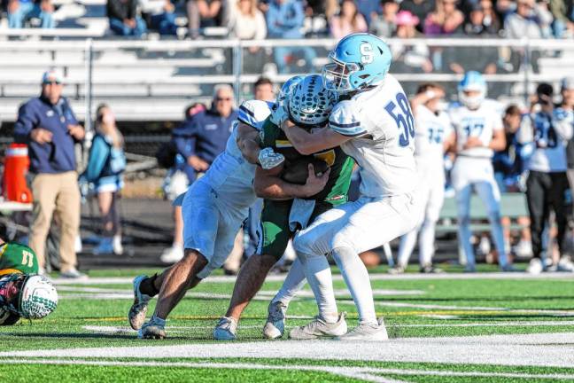 Football roundup: High Point advances to semifinal <b>Sparta linebacker Hunter Chlodnicki, left, and defensive end Austin McKenzie sack the Montville quarterback early in the fourth quarter. (Photo by Glenn Clark)</b>