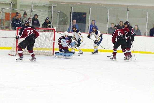 Pope John's beats Morristown-Beard on the ice Morristown-Beard's goalie Anthony DelTufo reacts to an incoming puck. DelTufo made 19 saves.