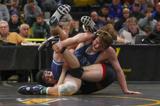 Spartan junior Troy Schmitzer demonstrates his agility and strength as he gets himself out of a hold at Saturday's Regionals Meet.