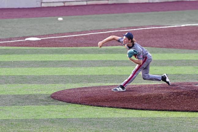 Miners lead division <b>Brockton Rox pitcher Michael Quigley throws the ball. He pitched for five innings.</b>