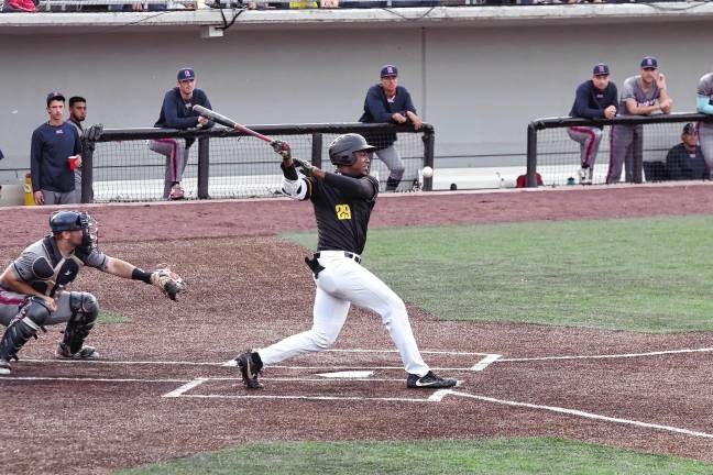 Miners lead division <b>MN4 The ball goes into foul territory after being hit by Miners batter Mahki Backstrom in the second inning. He scored one run in the game.</b>