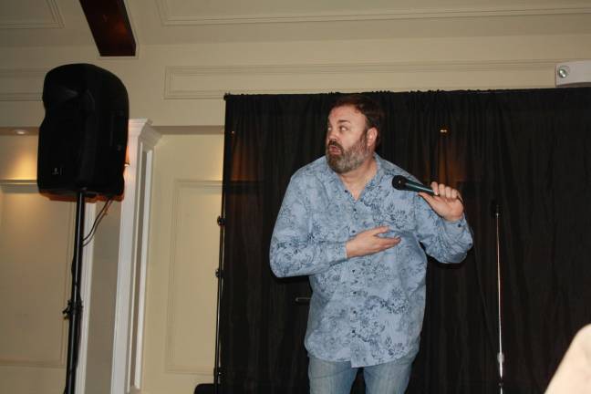 Laughter on the lakeside Chris Roach adds a little animation to his act.