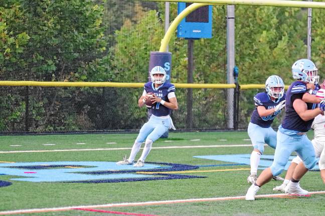 Vernon shuts out Dover <b>FB4 Sparta quarterback Shane Hoover is about to throw while his teammates hold back the opposition. He passed for 297 yards and four touchdowns.</b>