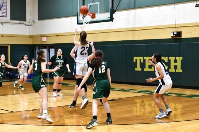 A Trinity Christian player shoots during the game.