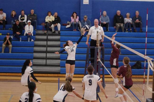 PJ3 Pope John's Avery Griffin strikes the ball. Griffin had two kills and one dig in the game against Morristown.