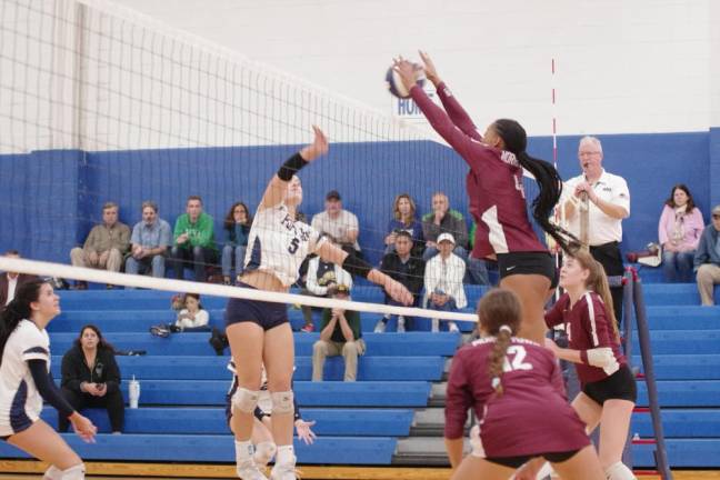 PJ1 The Pope John and Morristown girls volleyball teams battle on the court Friday, Sept. 29. (Photos by George Leroy Hunter)