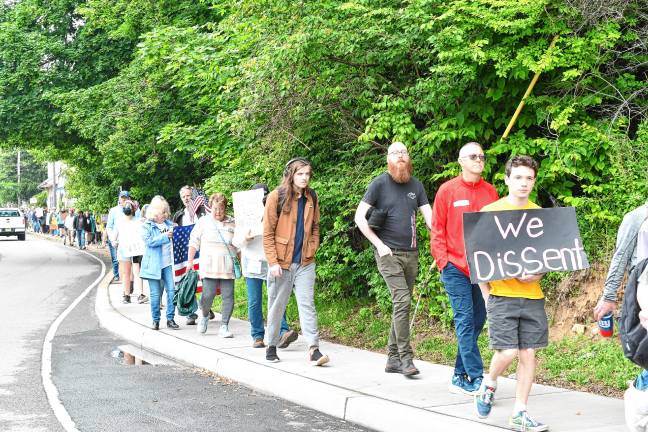 Speaker at ‘No Kings’ rally: ‘We believe in hope’ Residents march through Newton after a ‘No Kings’ protest Saturday, June 14 at the Newton Green. (Photos by Maria Kovic)