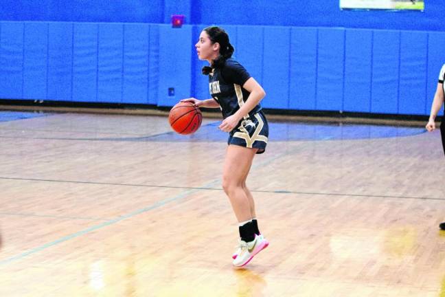 Pope John's Katie O'Keefe scored two points, grabbed two rebounds and made two assists. (Photo by George Leroy Hunter)