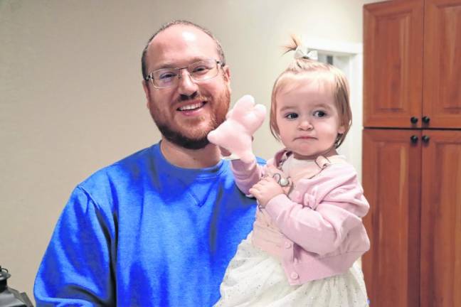 Mike Long holds Harper, 16 months.