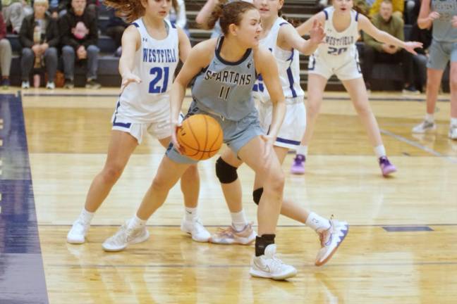 Sparta's Malaya Dobbs handles the ball in the second half of the game against Westfield on Saturday, Jan. 20. The Spartans lost, 57-27. Dobbs scored four points and made one rebound and one steal. (Photos by George Leroy Hunter)