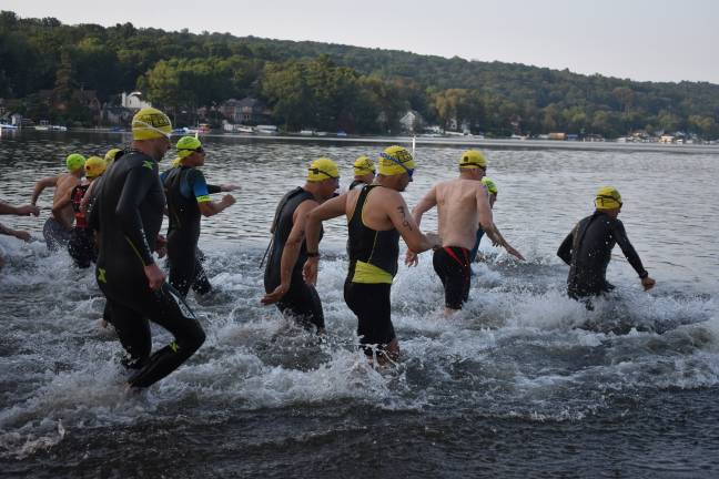 Bike, run, swim Athletes at the start of the swim portion of the Pass It Along Triathlon at Lake Mohawk on Saturday, July 27, 2019. (Photos provided)