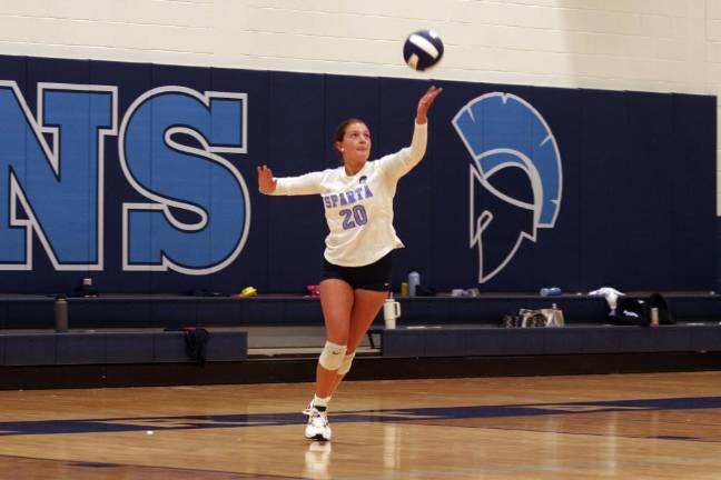 Girls soccer team shuts out Montville Sparta volleyball player Lea Tsamadias in the midst of a serve. Tsamadias is credited with six kills, two digs and one ace.