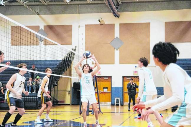 Sparta's George Tsamadias (5) performs a ‘set’ maneuver on the ball. He was credited with one block, 12 assists and one ace.