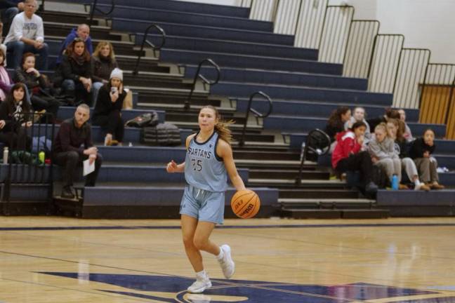 Sparta's Milly Dobbs dribbles the ball in the second half.