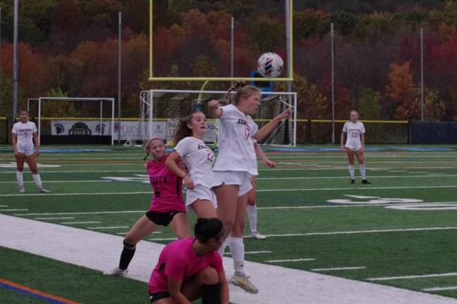 The ball bounces off the head of a Hunterdon Central player.