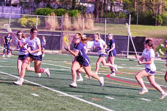 Sports roundup: Pope John wins H/W/S title Pope John's Olivia Zywicki is on the move with the ball in the game against Lenape Valley on May 1. She scored one goal. The Lions lost, 8-7. (Photos by George Leroy Hunter)