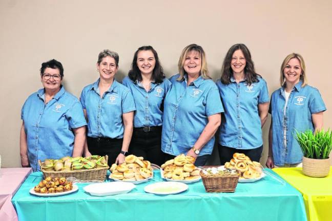 Volunteers assist with the breakfast.