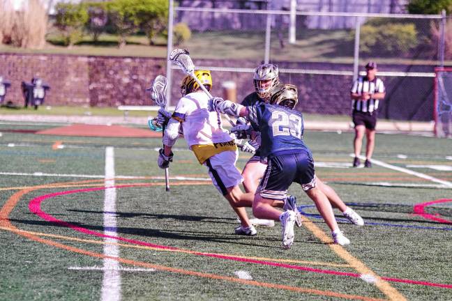 Sports roundup: Lions advance to H/W/S quarterfinal A ball-carrying Jefferson Falcon is pursued by a pair of Pope John Lions.