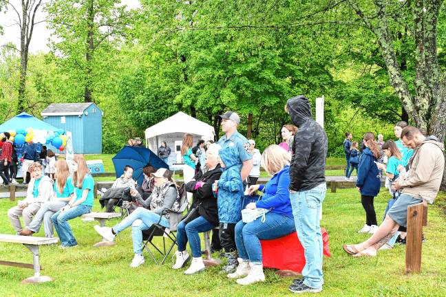 Township celebration marks 50th year People watch performers at the annual Sparta Day.
