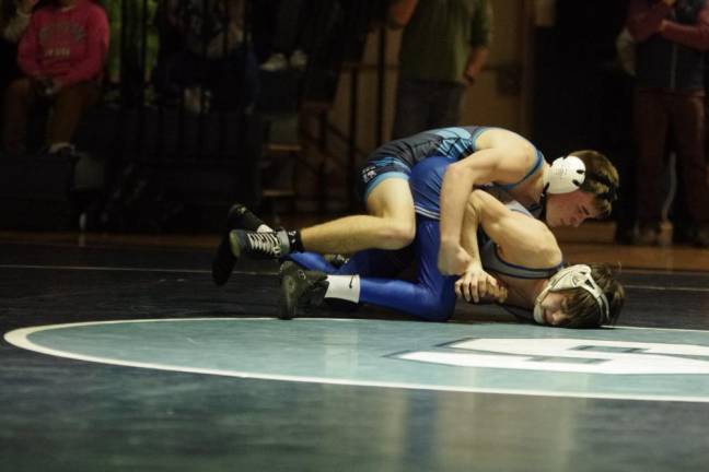 Sparta’s Patrick Bruseo, top, puts pressure on Kittatinny’s Nikolas Martinez in the 120-pound weight class. Bruseo won by decision, 3-0.