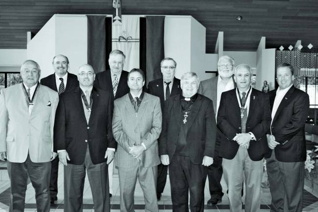 Blessed Kateri officers at the installation ceremony. Pictured: (front row) Werner Kuenzle, Frank Masters, Grand Knight Mike Sawey, Blessed Kateri pastor Father Patrick Rice, Jim Brocato and Jerry Scanlan. (Back row) Vince Bell, Tom Gibbons, Randy Booth, and John Pappalardo.