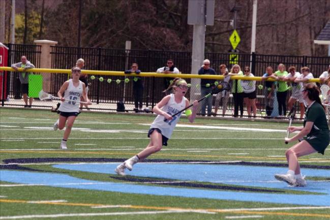 Sparta’s Norah Monaghan is on the move with the ball in the first period. Monaghan scored one goal and made one assist.