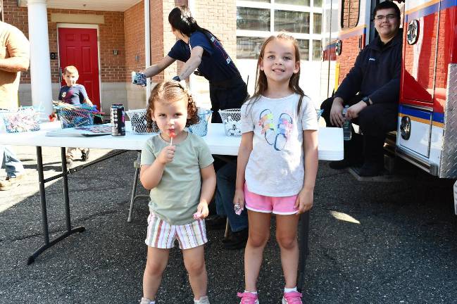 Sparta Township observes Fire Prevention Week Cameron and Avery Alberts from Sparta eat a lollipop at Fire Prevention Week.