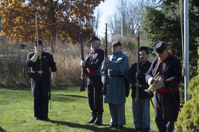 Civil War reenactors honoring military members from all eras