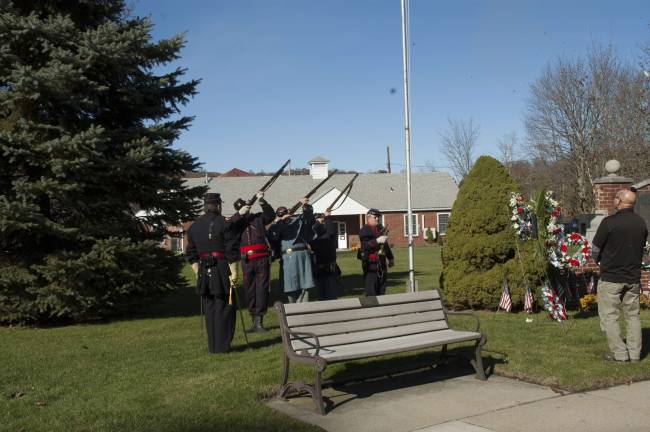 Sparta honors its veterans Salute from the antique rifles of Civil War re-enactors Photos by David Case
