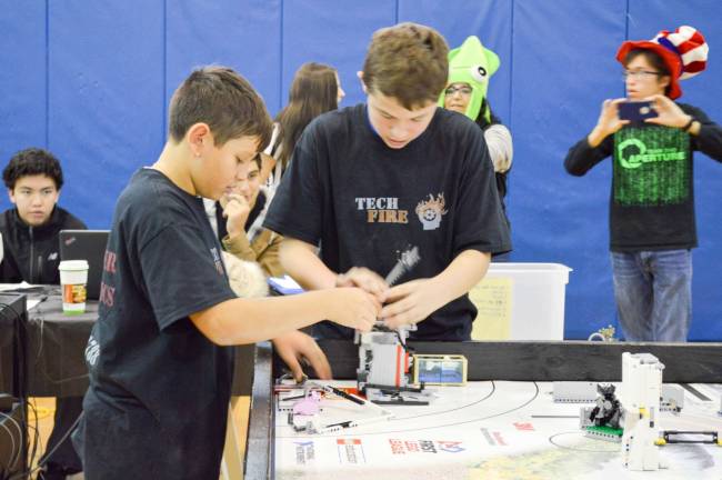 Long Pond School Team &quot;Tech Fire&quot; setting up their robot to play the game PHOTOS BY LIAM OAKES