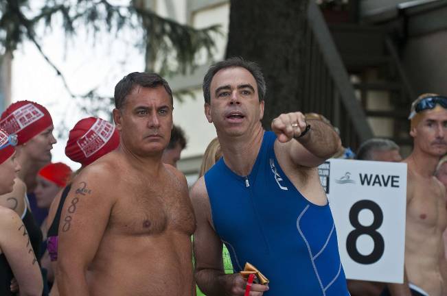 Triathlon draws athletes from 13 states From left, Ken Choldnicki of Sparta and Mark Patalive of Sparta watch an early wave of swimmers. Photos by Warren Westura