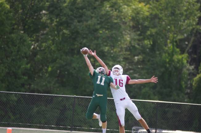 Roselle Park whups Tech, 33-7 Sussex Tech wide receiver Ryan Kinkead (11) gets a hand on the ball while covered by Roselle Park defensive back Patrick Gergich in the first half. Kinkead was unable to hold onto the ball.