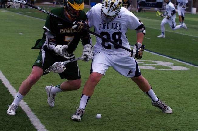 Pope John lacrosse loses to New Providence in tight game New Providence Pioneer James Burke and Pope John XXIII Lion Jordan LeFrois clash. New Providence beat Pope John XXIII on their home turf in high school boys varsity lacrosse on Saturday, March 29, 2014. The final score was 7-6. The game was played at Pope John XXIII High School in Sparta, New Jersey.